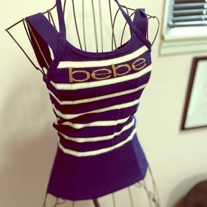 Bebe navy top with gold accents